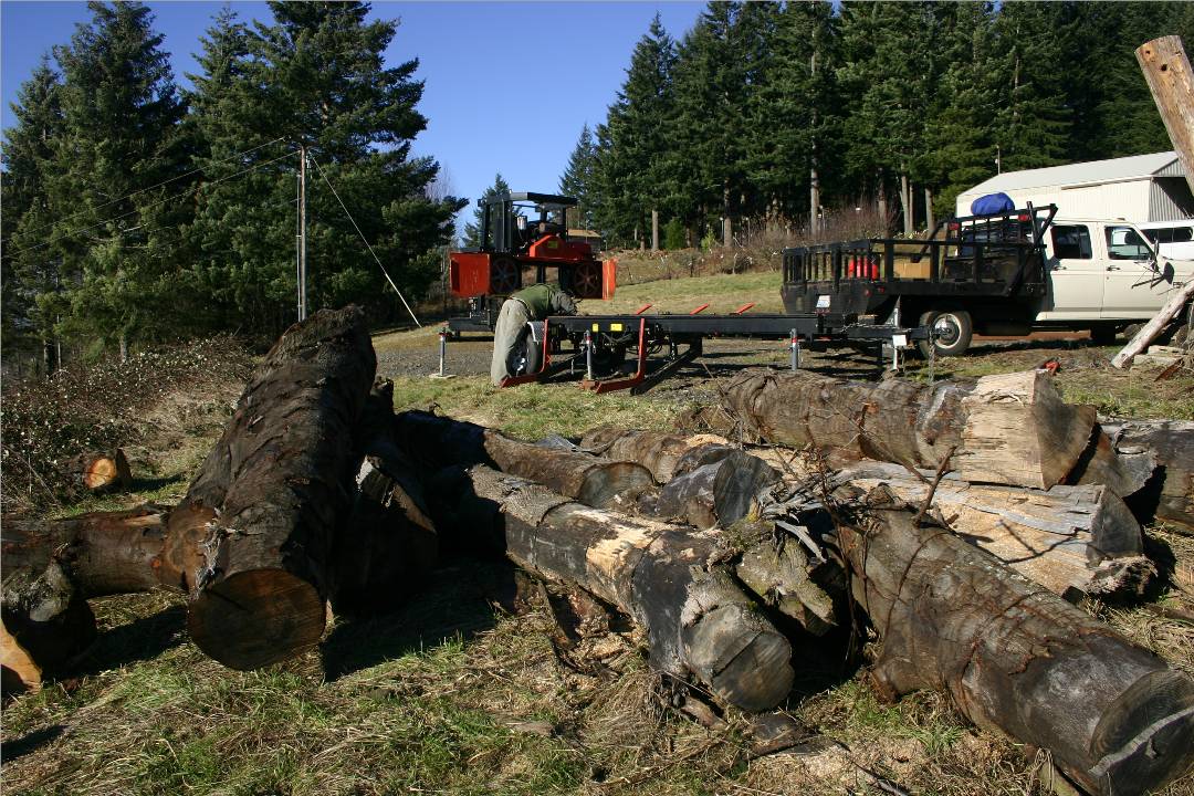 Jeff Nelson of Treecycle is setting up the sawmill.